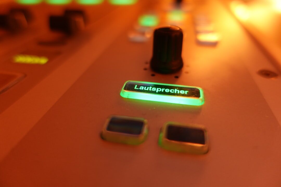 Close-up of a video vision mixer panel with illuminated buttons